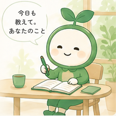 机に向かって書くきっこ